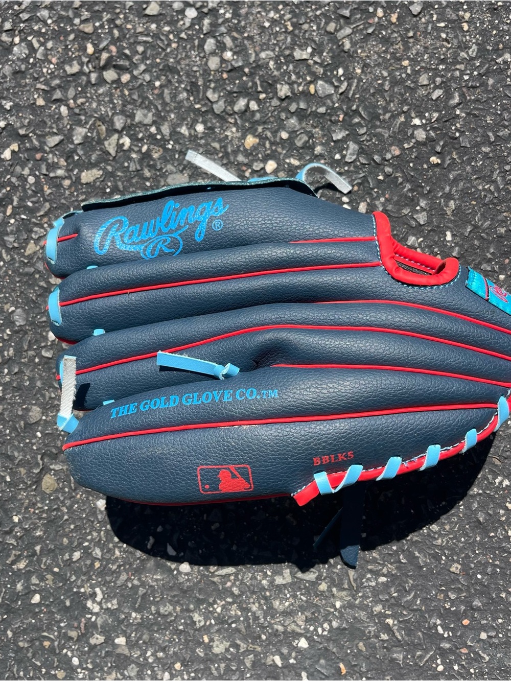 Kids Rawlings Navy Glove with Red and Light Blue Accents